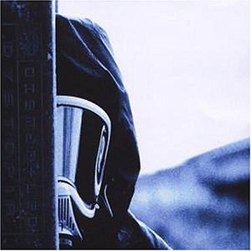 Hooded figure with gas mask, blue tones, and text on the left.
