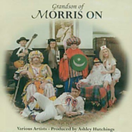 "CD cover featuring a group of people in various costumes, posing together indoors."