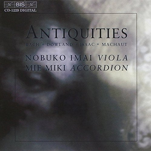 CD cover with dark, blurry background and black text "Antiquities" and artist names.