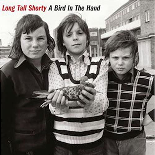 Three young boys with a bird, album cover for Long Tall Shorty.