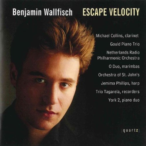 "Album cover featuring a man with short brown hair against a dark background."