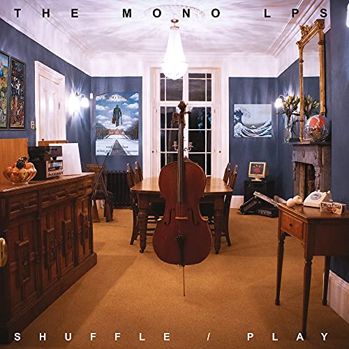 Album cover: cello in a room with blue walls and wooden furniture.