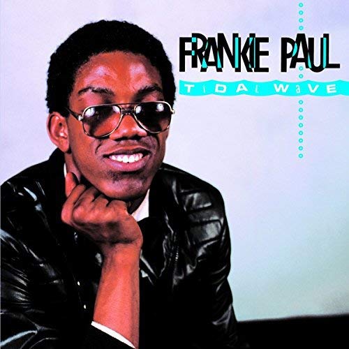 "Album cover featuring a man in sunglasses and leather jacket, smiling."