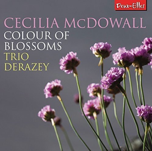 "CD cover featuring pink flowers on grey background with artist and title text."