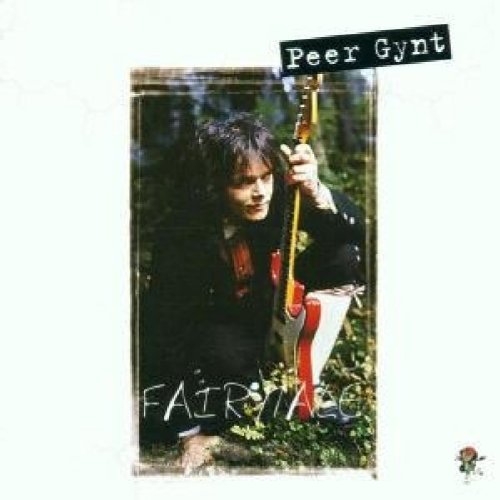 The alt text for the image is: "Album cover with a man holding a guitar in a forest."