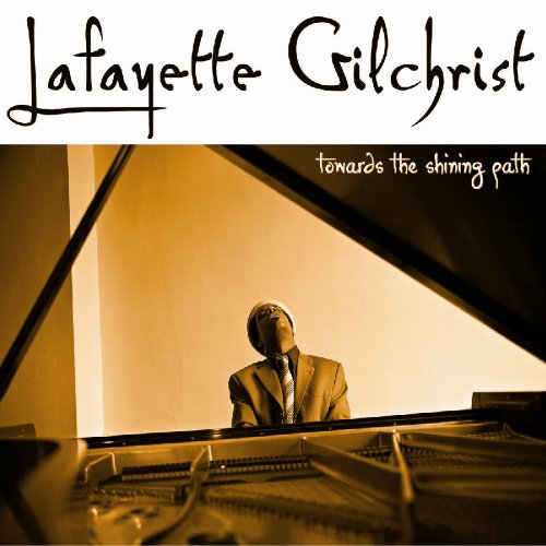 Album cover: man in suit sitting at grand piano, sepia-toned, with artist and title text.