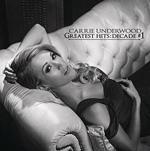 Black and white album cover featuring Carrie Underwood reclining on a white couch.