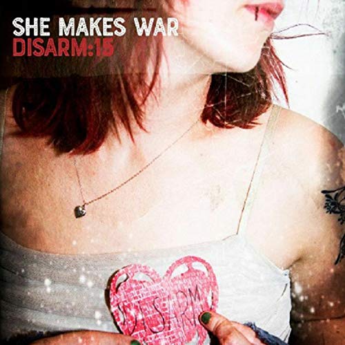 Album cover for She Makes War’s “Disarm:15” featuring a woman and a heart.
