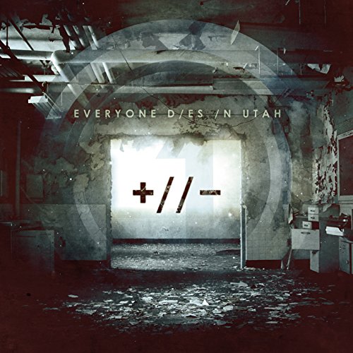 "Album cover with a dimly lit, dilapidated room and a plus-minus symbol."