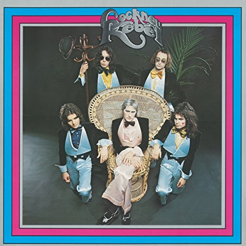 "Album cover with band members posing around a seated man in a wicker chair."