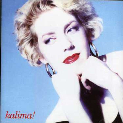 Blonde woman in black dress, red lips, and large hoop earrings against a blue background.