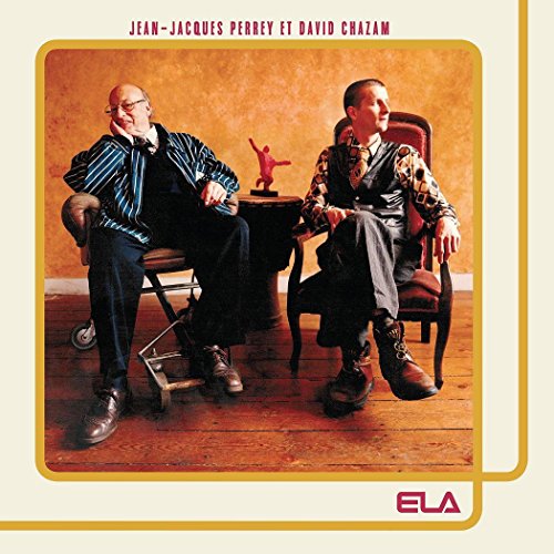 "Album cover featuring two men sitting in chairs, with a small statue on a table."