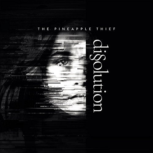 Black album cover with distorted face and white text "The Pineapple Thief - Dissolution".