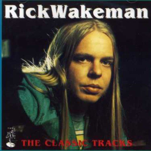 "Album cover with Rick Wakeman's portrait, long blonde hair, and dark background."