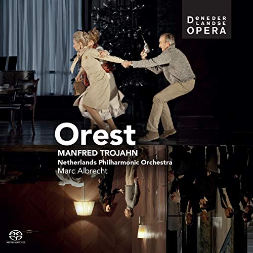 "Opera album cover featuring a dramatic stage scene with performers and a conductor."