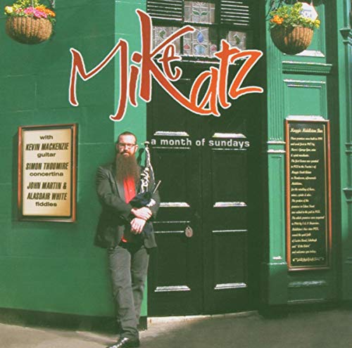 CD cover: Mike Katz with a saxophone stands before a green pub.