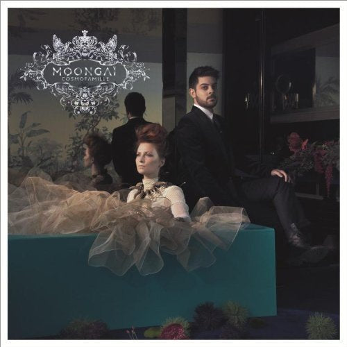 CD cover featuring three people in formal attire, ornate design.