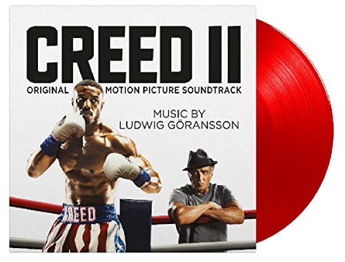 "Creed II soundtrack vinyl record with red vinyl and album cover featuring boxing imagery."