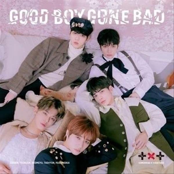 TOMORROW X TOGETHER album cover featuring five young men in stylish outfits.