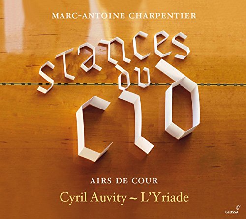 "CD cover with 'stances du cid' cut-out letters on a wooden surface."