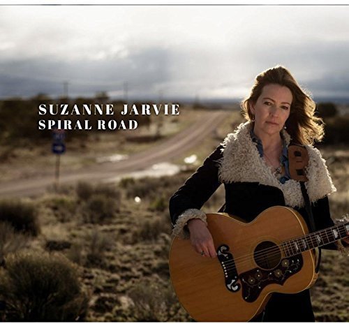 "Album cover featuring a woman holding a guitar in a rural landscape."