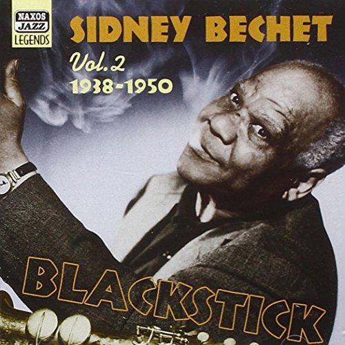 "Sidney Bechet album cover featuring a man holding a clarinet, smoking a cigar."
