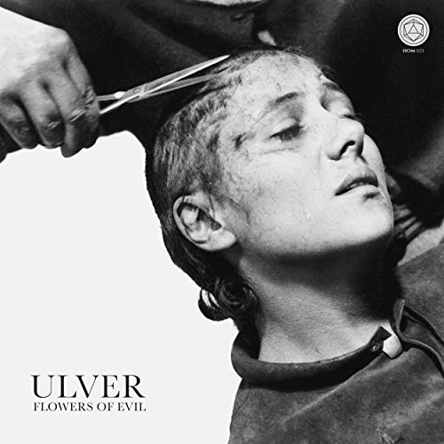 Black and white photo of a person getting their hair cut, album cover.