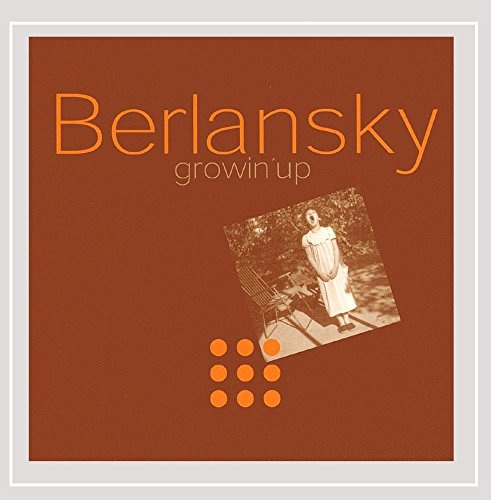 "CD cover with a brown background, orange text, and a sepia-toned photo of a woman."