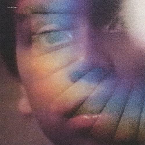 Close-up of a face obscured by colorful, blurred light and hands.