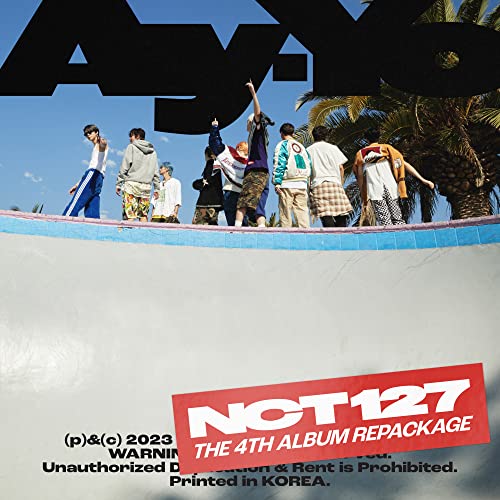 NCT 127 album cover featuring nine members standing by a skatepark.