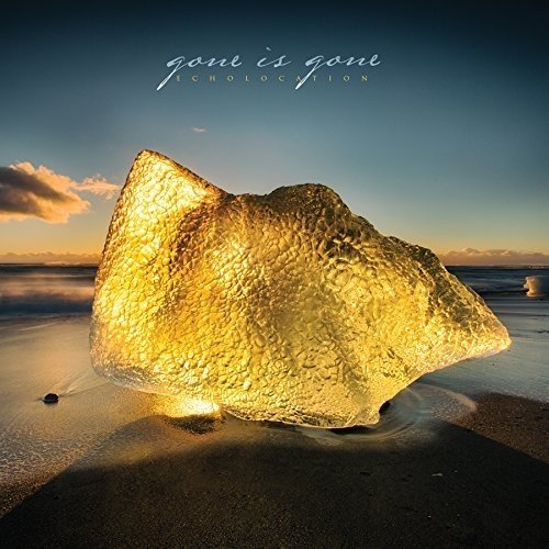 "Album cover featuring a large rock on a beach at sunset, with 'gone is gone' text."