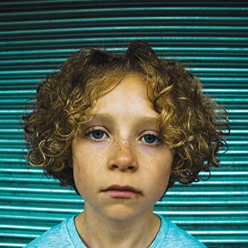 CD cover featuring a close-up portrait of a young boy with curly hair.