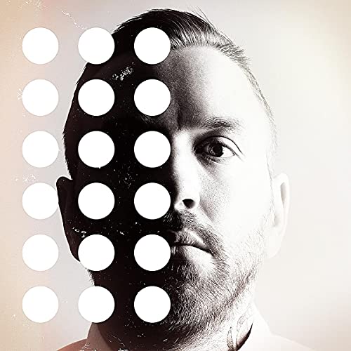 A split-tone portrait of a man with a grid of white circles overlaid.