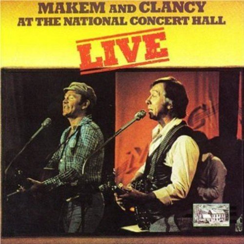 "Album cover featuring two men singing into microphones on a concert stage."