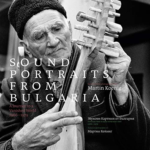 Black and white portrait of an elderly man playing a stringed instrument.