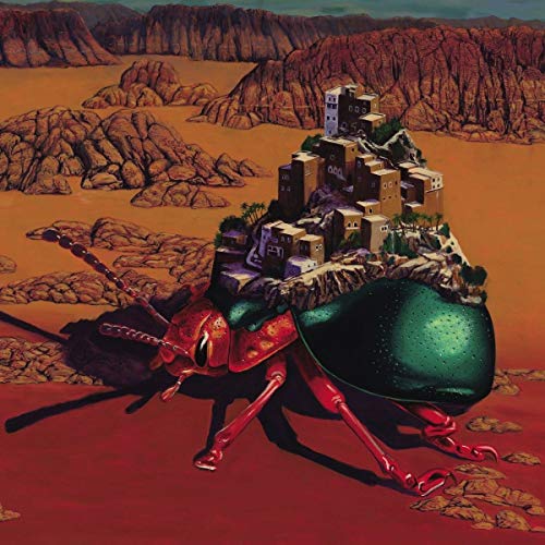Album cover featuring a large red beetle carrying a small town on its back.
