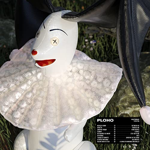 White clown doll with a ruffled collar, album cover for Ploho.