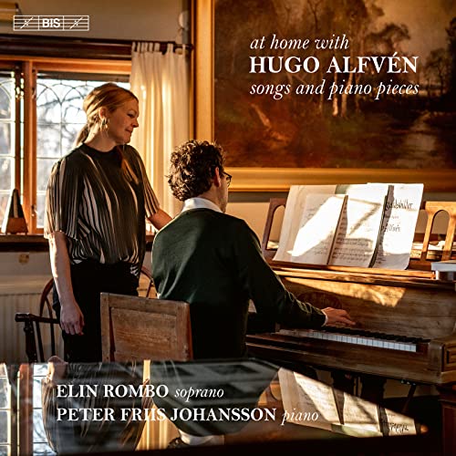 CD cover: woman and man by a piano in a room.