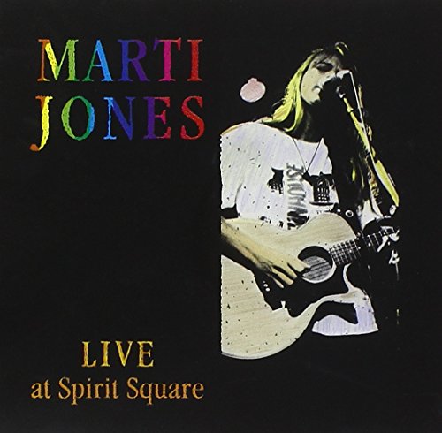 "Album cover featuring Marti Jones playing guitar and singing into a microphone."