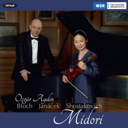 Violinist Midori and pianist Özgür Aydın in formal wear with instruments.