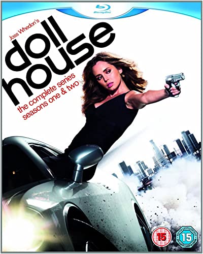 A woman in a black dress holds a handgun while leaning against a sports car.