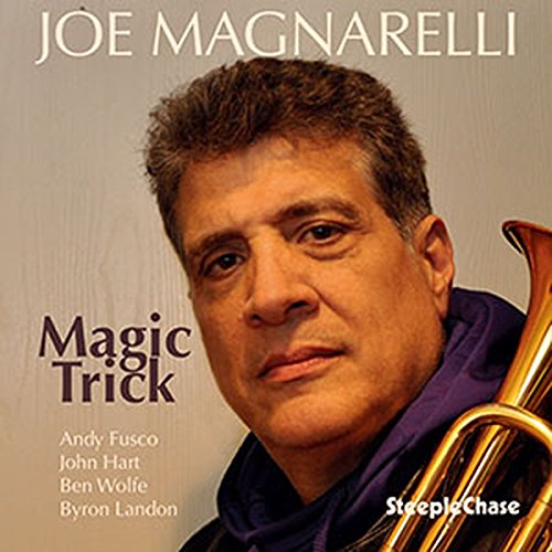 "Album cover featuring a man holding a trumpet, with title and artist name."