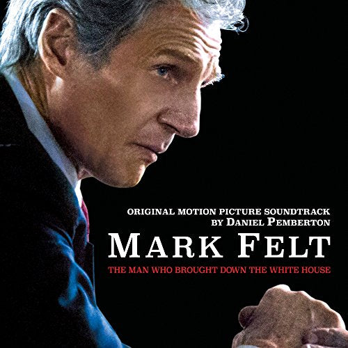 "Soundtrack CD cover featuring a close-up of an older man in a suit."