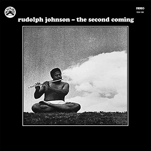Black and white album cover featuring a man playing a flute outdoors.