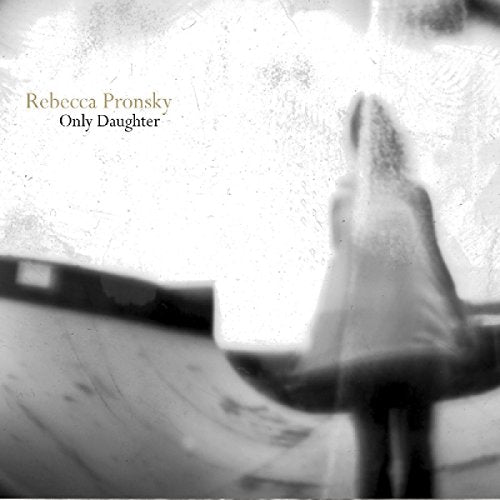 "Album cover with a blurred black and white image of a woman walking."