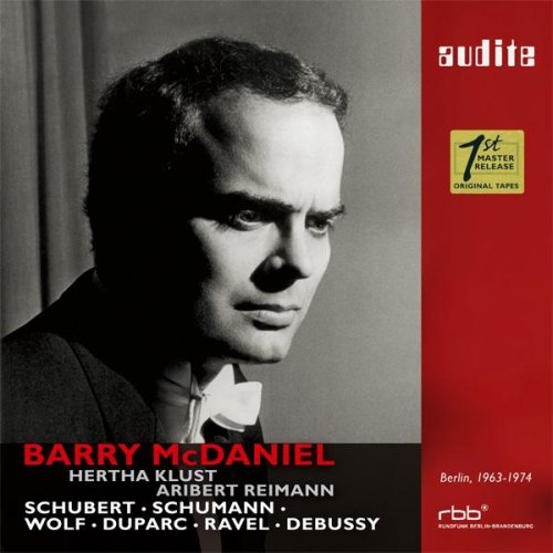 "CD cover with black and white photo of man and red, black panel."