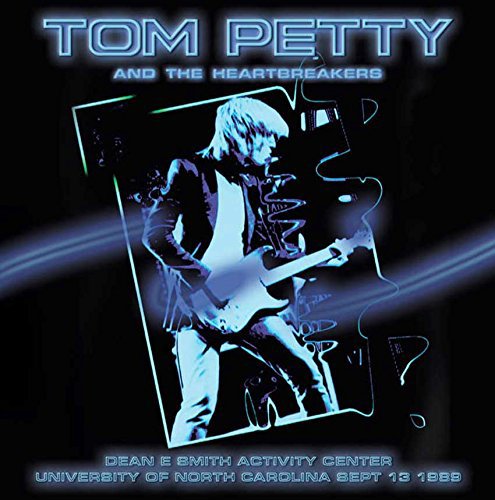 Tom Petty album cover featuring a blue-toned image of him playing guitar.