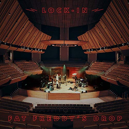 Album cover for Fat Freddy’s Drop “Lock-in” featuring a concert hall stage.