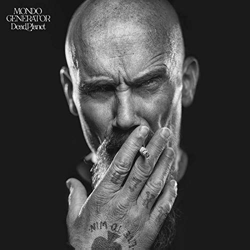 Black and white portrait of a man smoking, album cover for Mondo Generator.