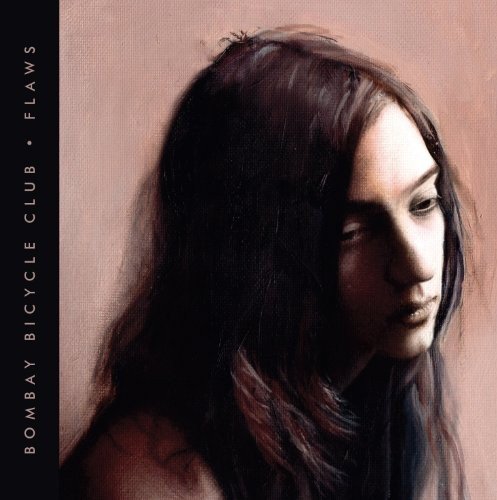 "Album cover with a painting of a woman with long dark hair."